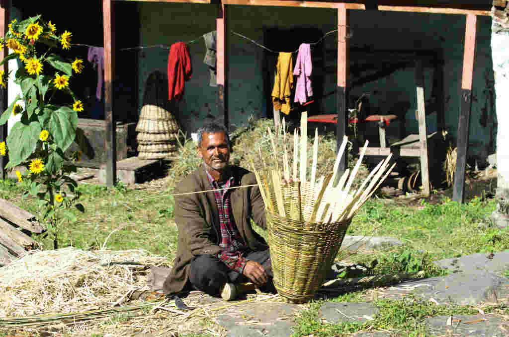 Traditional Subsistence: A villager making bamboo basket - Kilta ( Click to enlarge) 